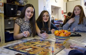 Students playing board games