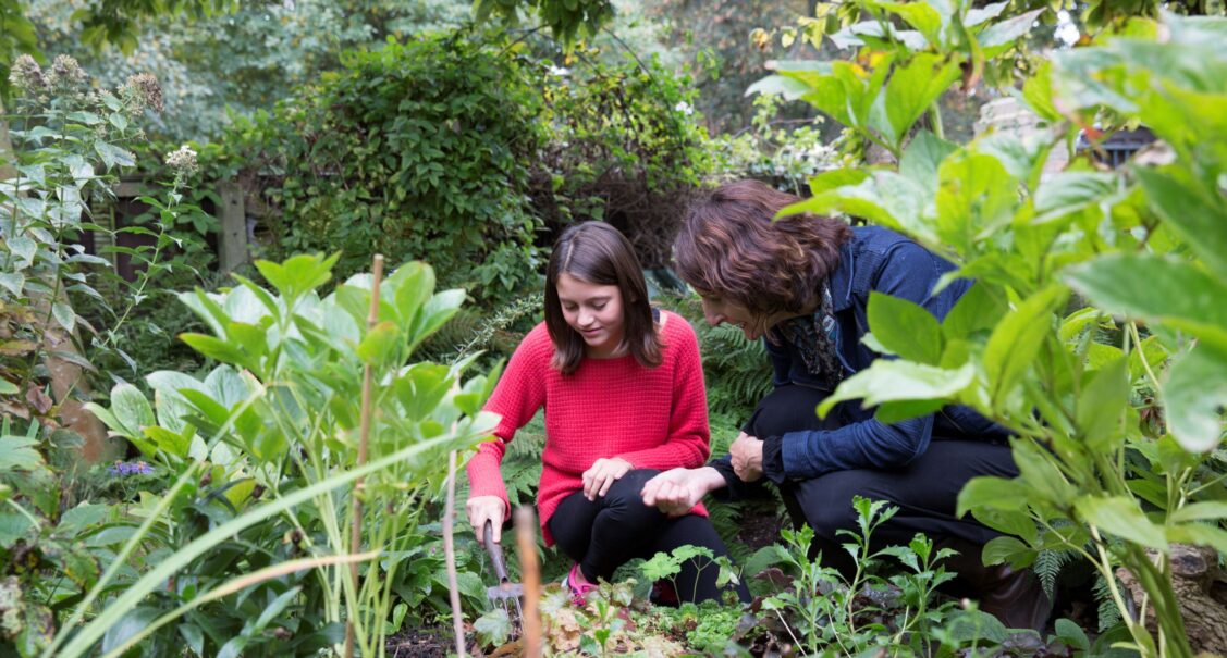 Student and mentor by pond