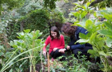 Student and mentor by pond