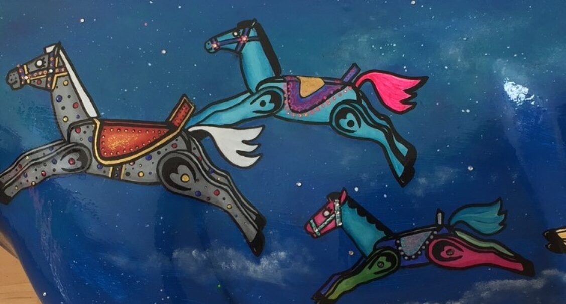 Museum of Cambridge mini-moo, rocking horses on a night sky by artist Marlis Horgan