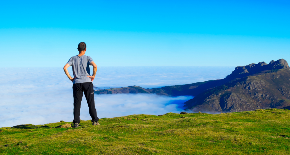 Photo of a man looking out to see - representing a Red Balloon alumni